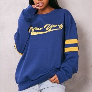 Pretty Little Thing Blue New York Varsity Print Sweatshirt